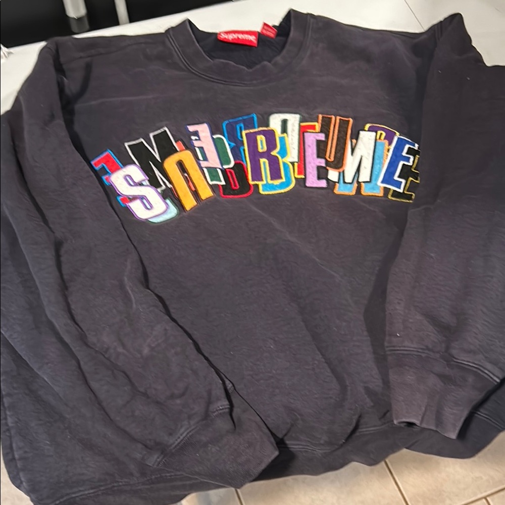 Supreme Black Crewneck Sweater with Vibrant Logo